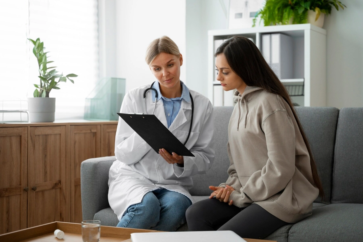 Medical professional and woman reviewing a chart