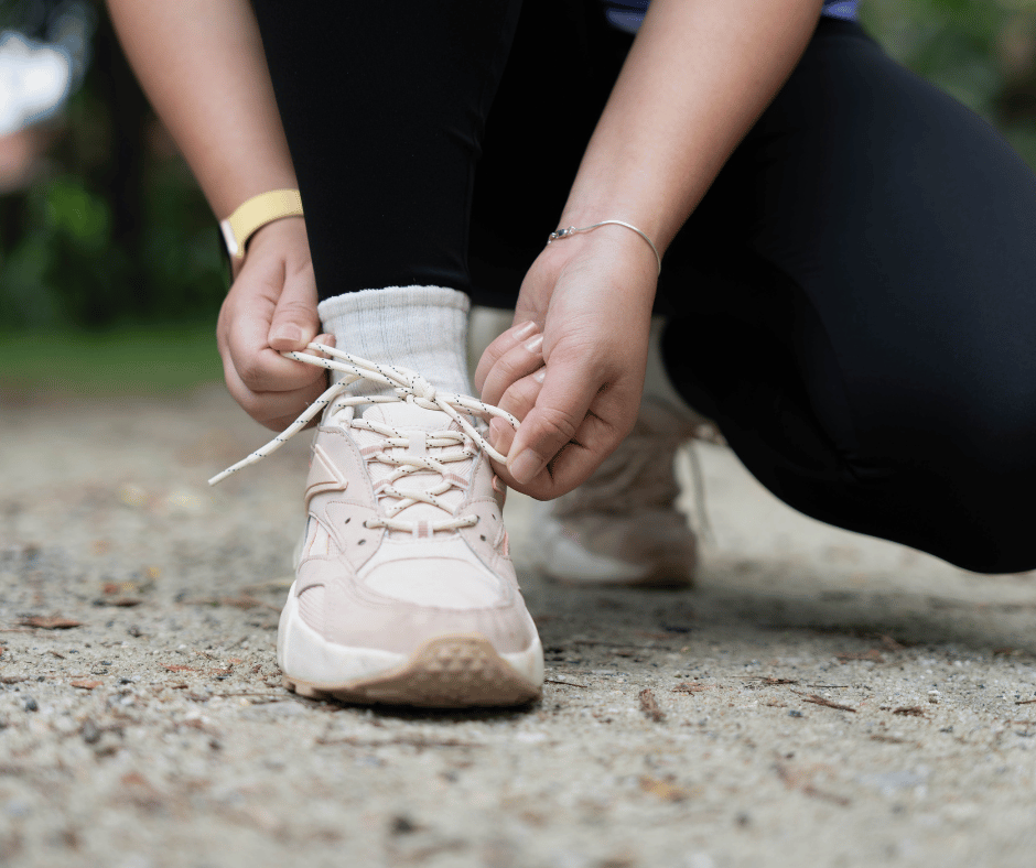Person tying their shoe